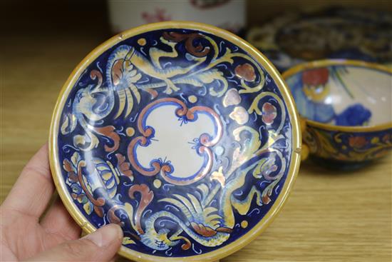 A Cantagalli cup and saucer, two plates and an armorial lidded decanter